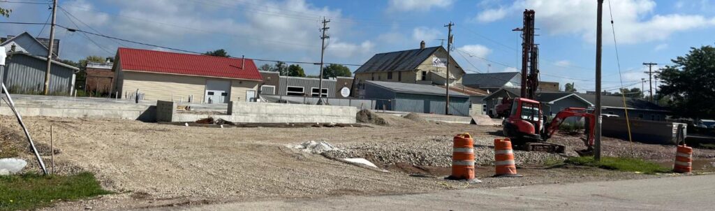 Photo of Construction Site on September 15th. The ground is cleared and concrete is placed.